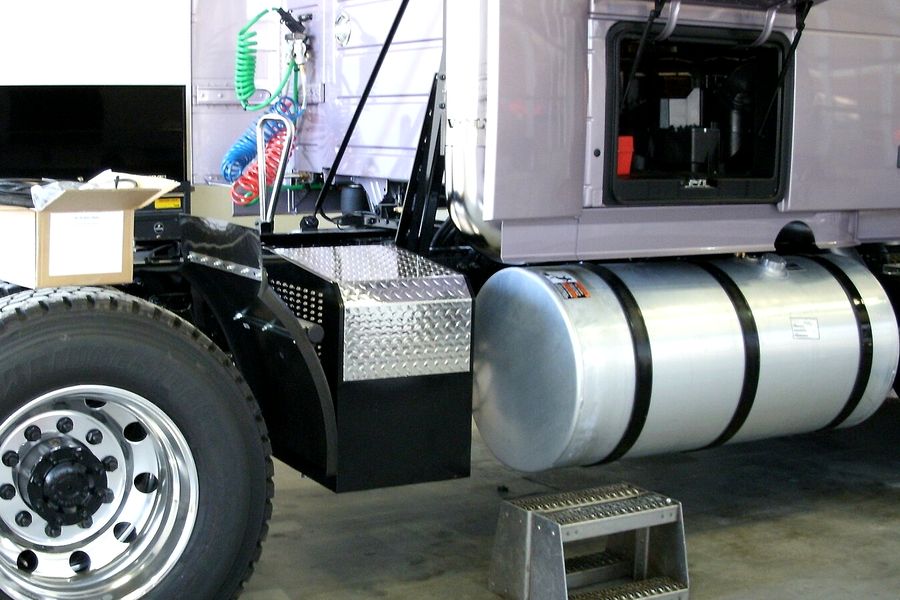 Auxiliary power unit (APU) mounted on a truck frame behind the cab